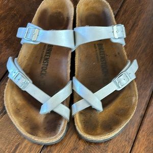 Birkenstock sandals silver in color